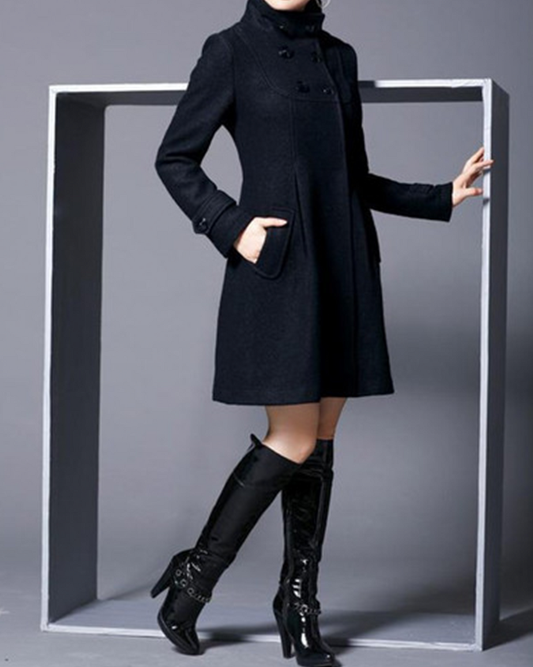 Mid-length coat with hood and high neckline