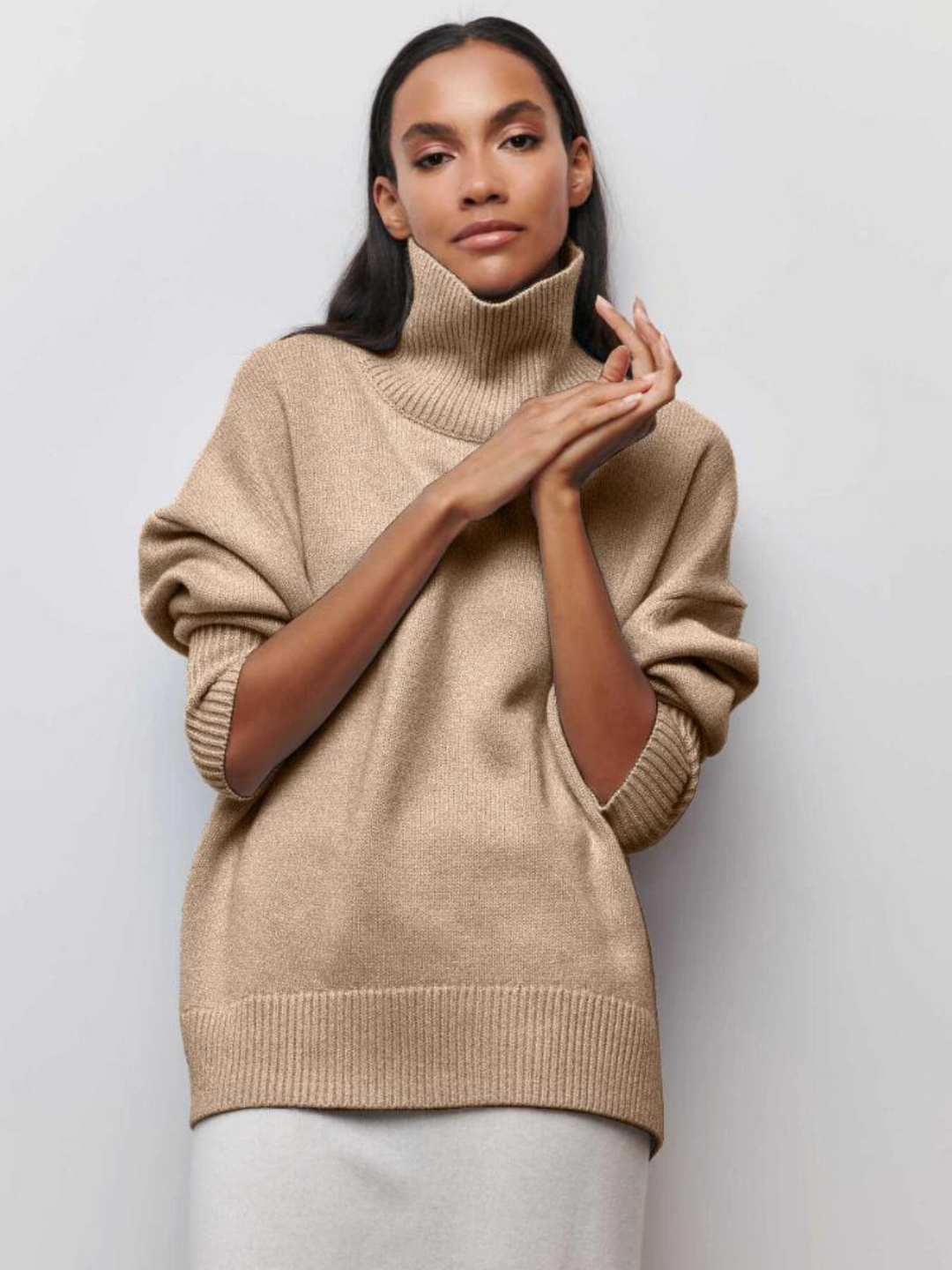 loose-fitting turtleneck sweater