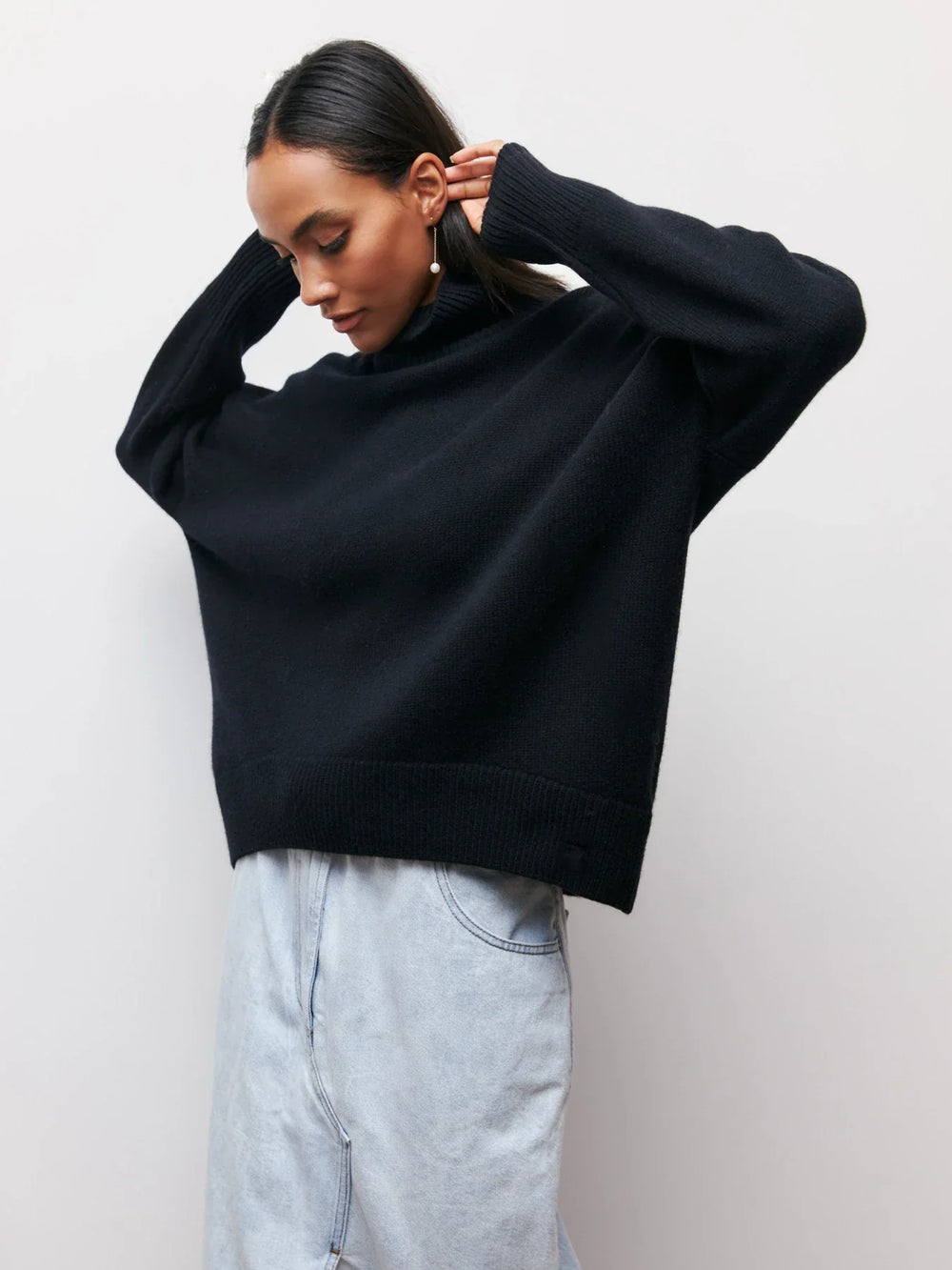 loose-fitting turtleneck sweater