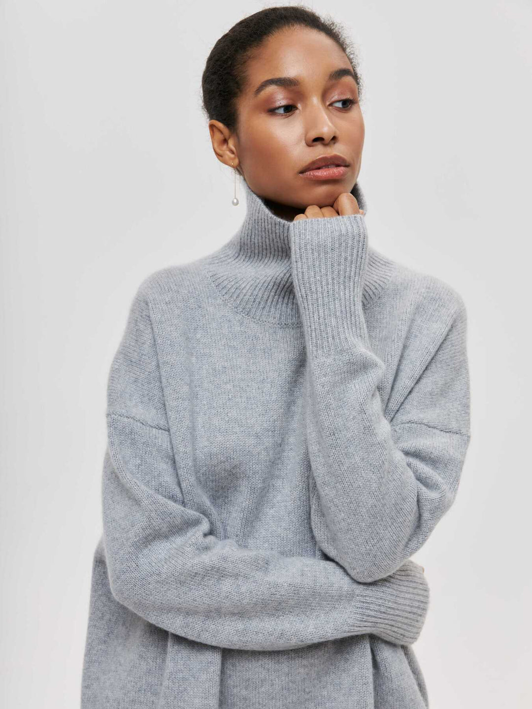 loose-fitting turtleneck sweater