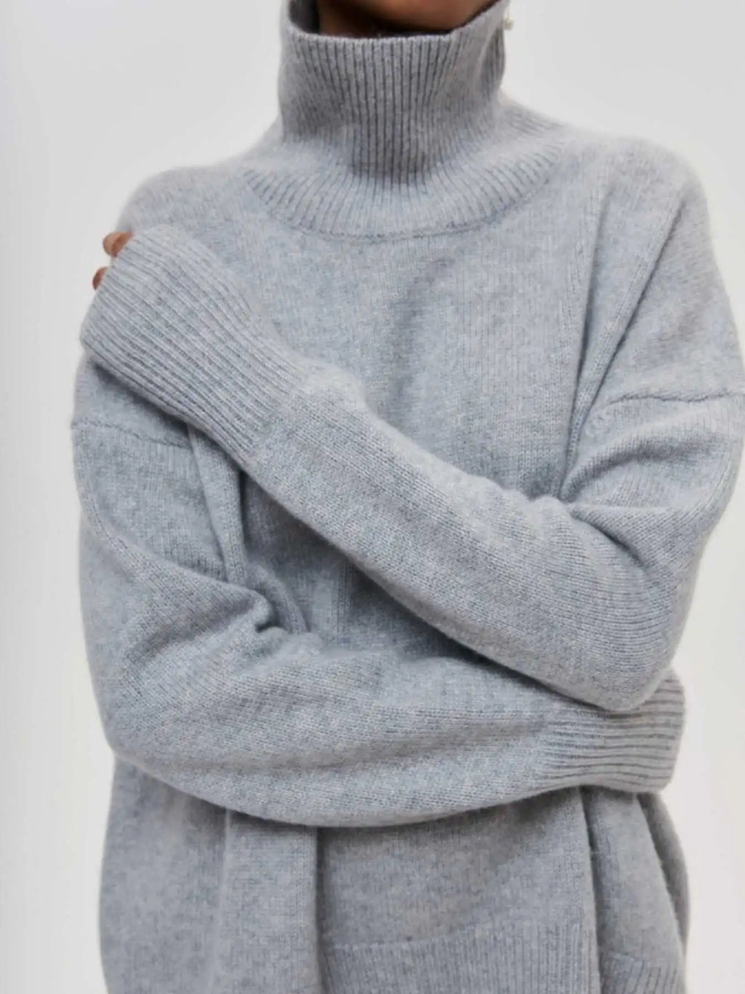 loose-fitting turtleneck sweater