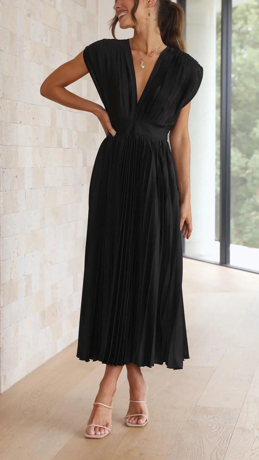 dress with deep V-neck and back strap